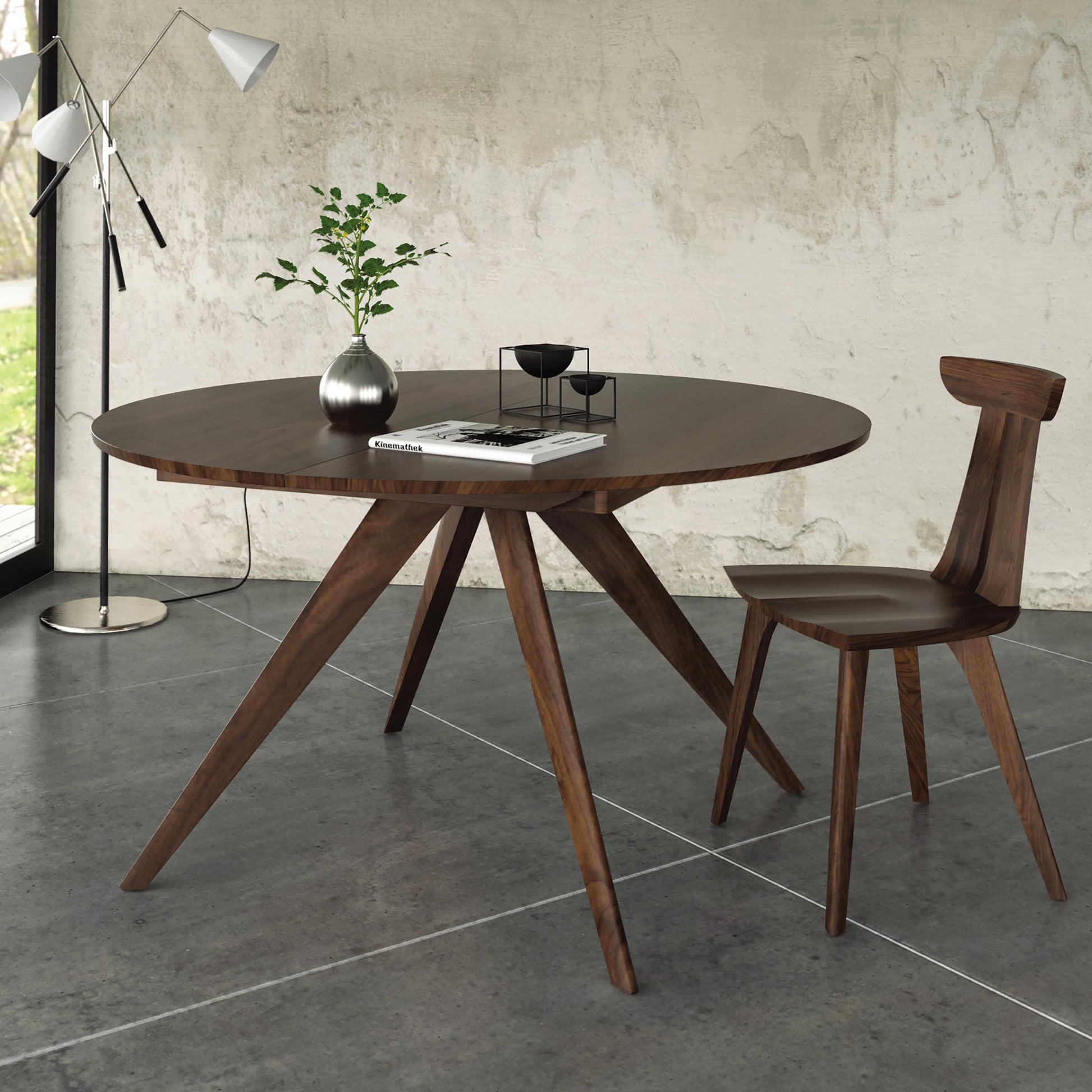 Copeland Furniture Catalina Round Extension Table with matching chair, showcasing elegant hardwood craftsmanship and modern design.