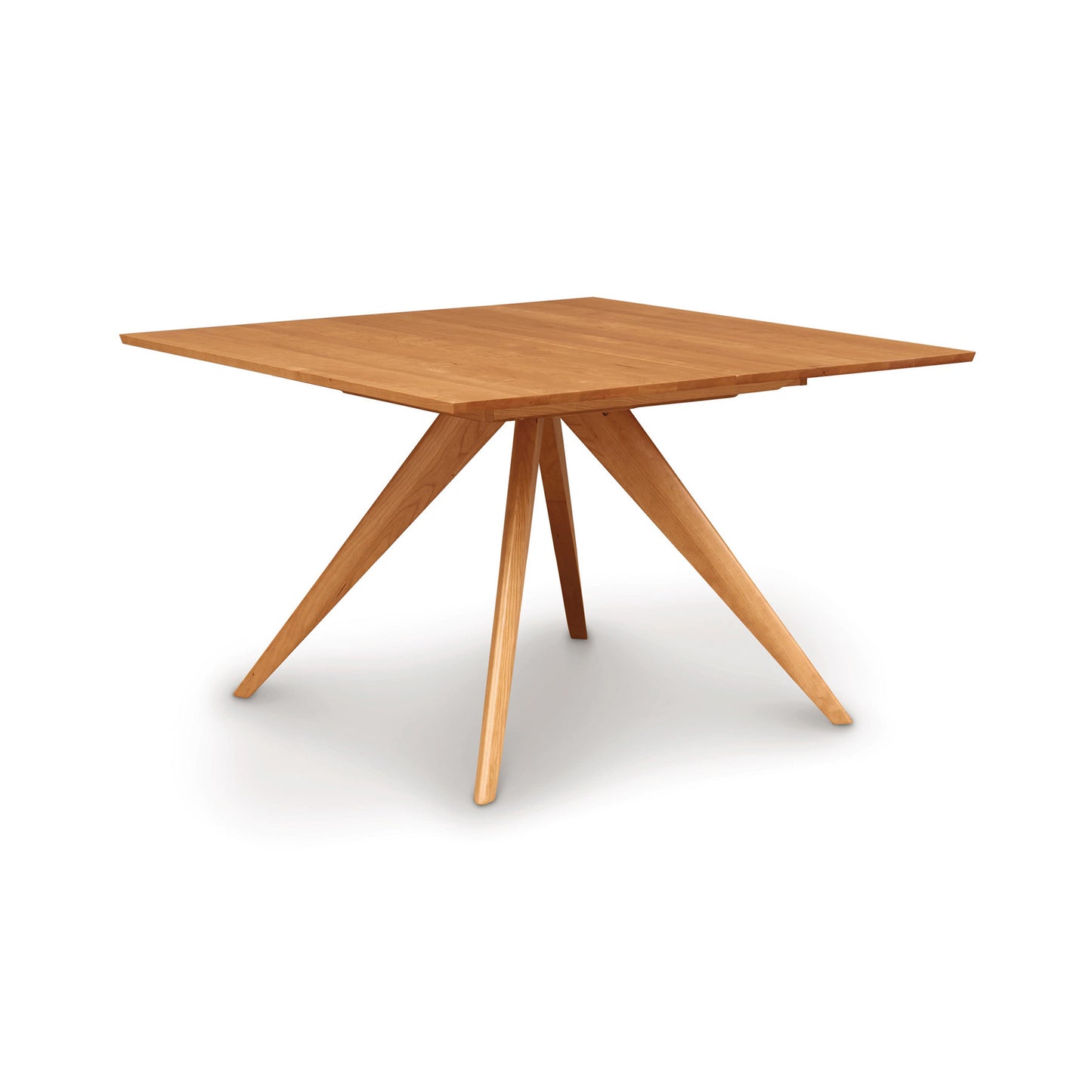 A Catalina Square Extension Dining Table crafted from sustainably harvested wood by Copeland Furniture, with a rectangular top and angled legs, set against a white background.