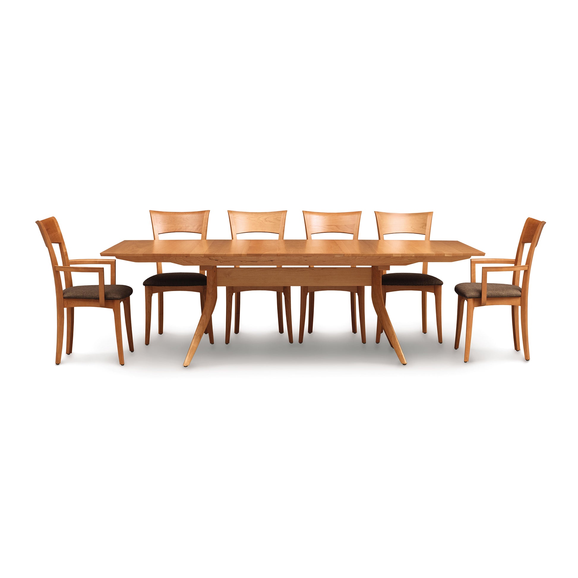 Catalina Trestle Extension Table by Copeland Furniture with six mid-century chairs featuring curved backs and dark upholstered seats, all crafted in premium wood.
