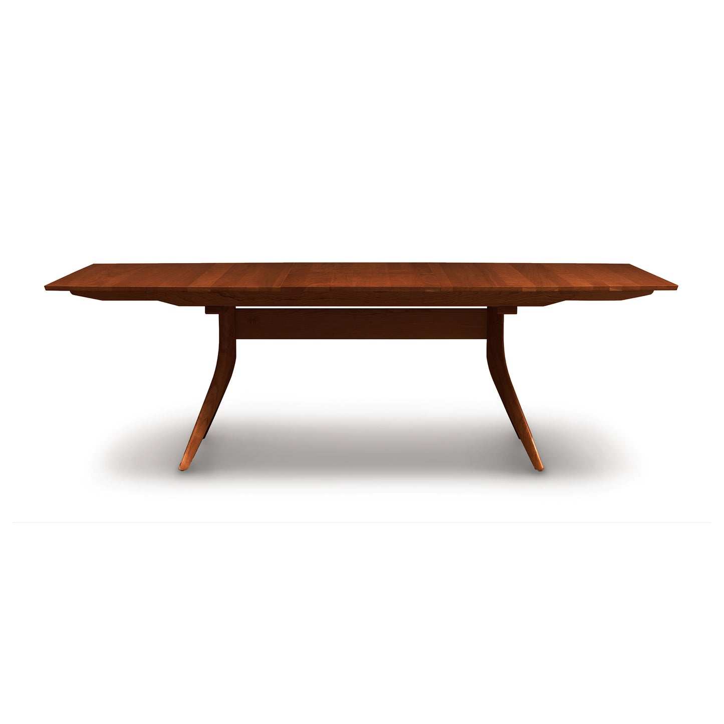 Catalina Trestle Extension Table by Copeland Furniture, showcasing angled legs and a smooth solid American hardwood top.