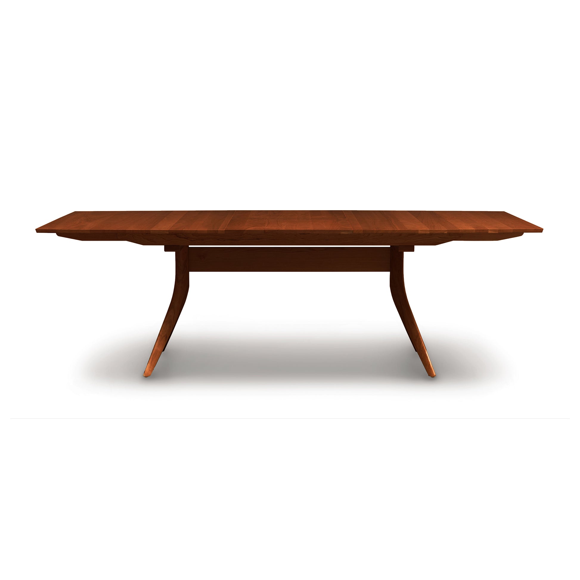 Catalina Trestle Extension Table by Copeland Furniture, showcasing angled legs and a smooth solid American hardwood top.
