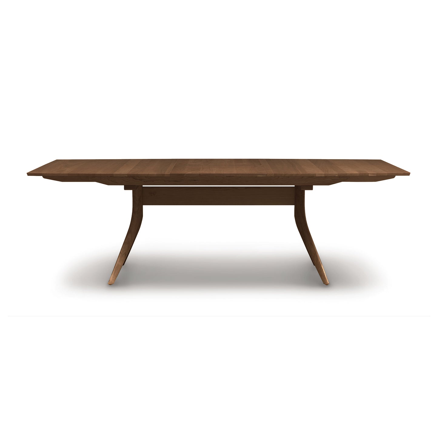 Copeland Catalina Trestle Extension Table made of solid American hardwood, featuring distinctive angled legs and a sturdy support bar.