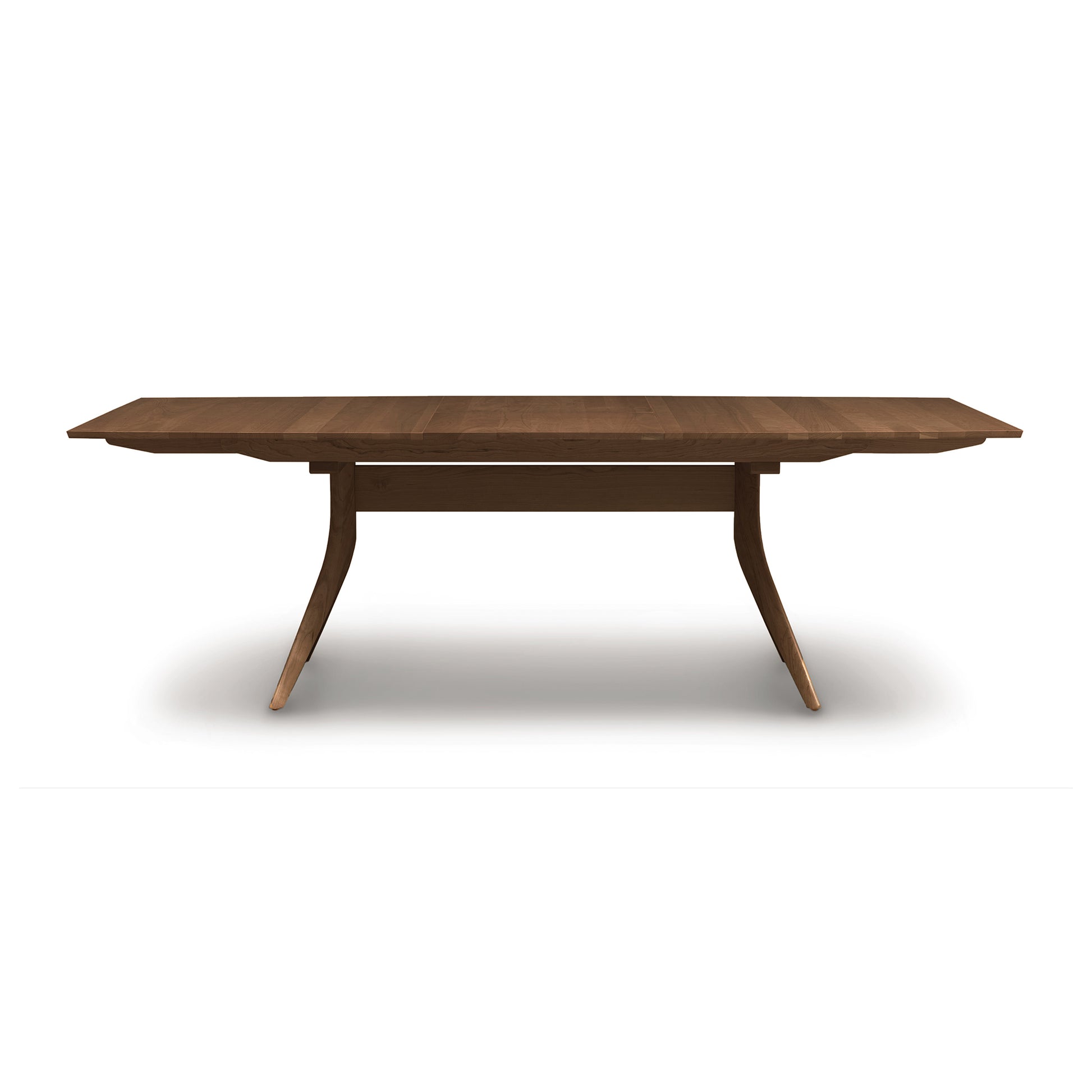Copeland Catalina Trestle Extension Table made of solid American hardwood, featuring distinctive angled legs and a sturdy support bar.