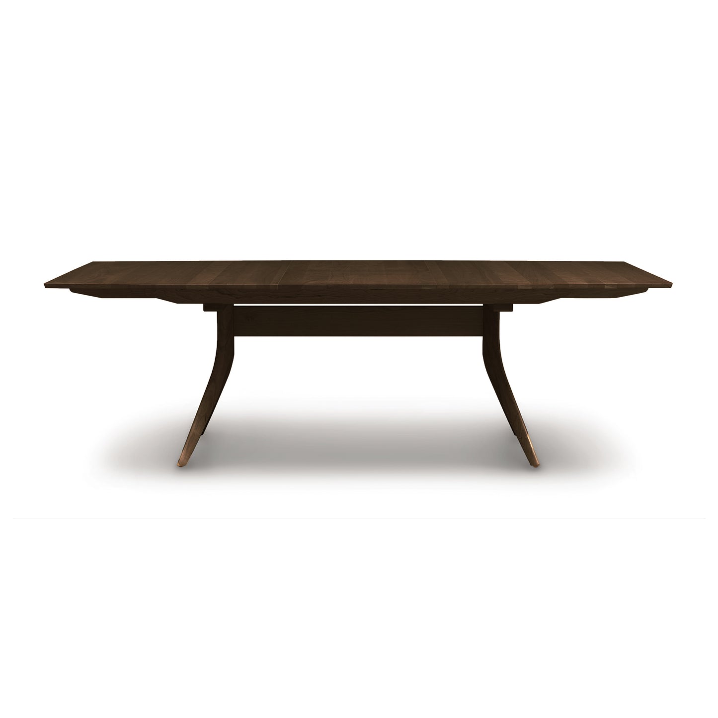Catalina Trestle Extension Table by Copeland Furniture in solid hardwood, featuring a rectangular top with distinctive angled legs and a horizontal support bar.
