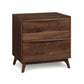 A contemporary style Copeland Furniture Catalina 2-Drawer Nightstand made from solid natural hardwoods with angled legs on a white background.