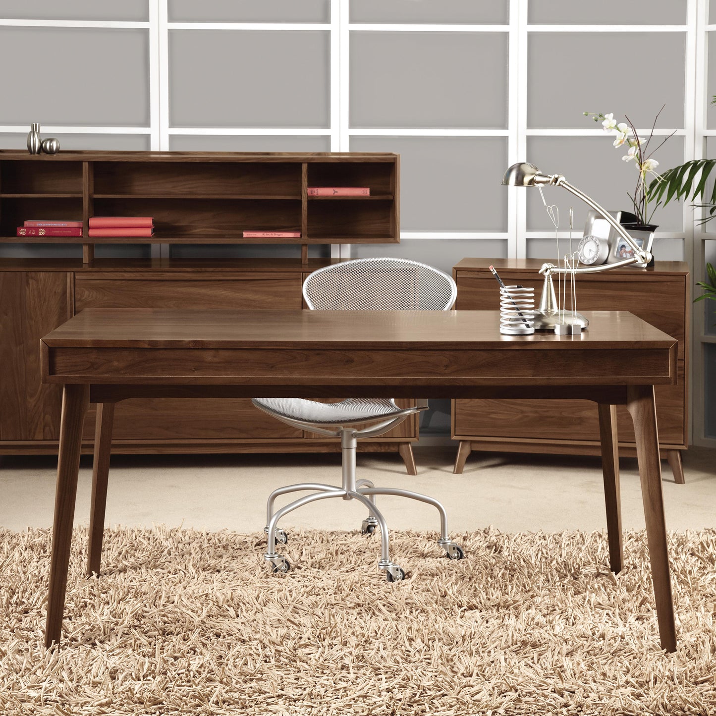 Copeland Furniture's Catalina Desk in walnut with a silver swivel chair.