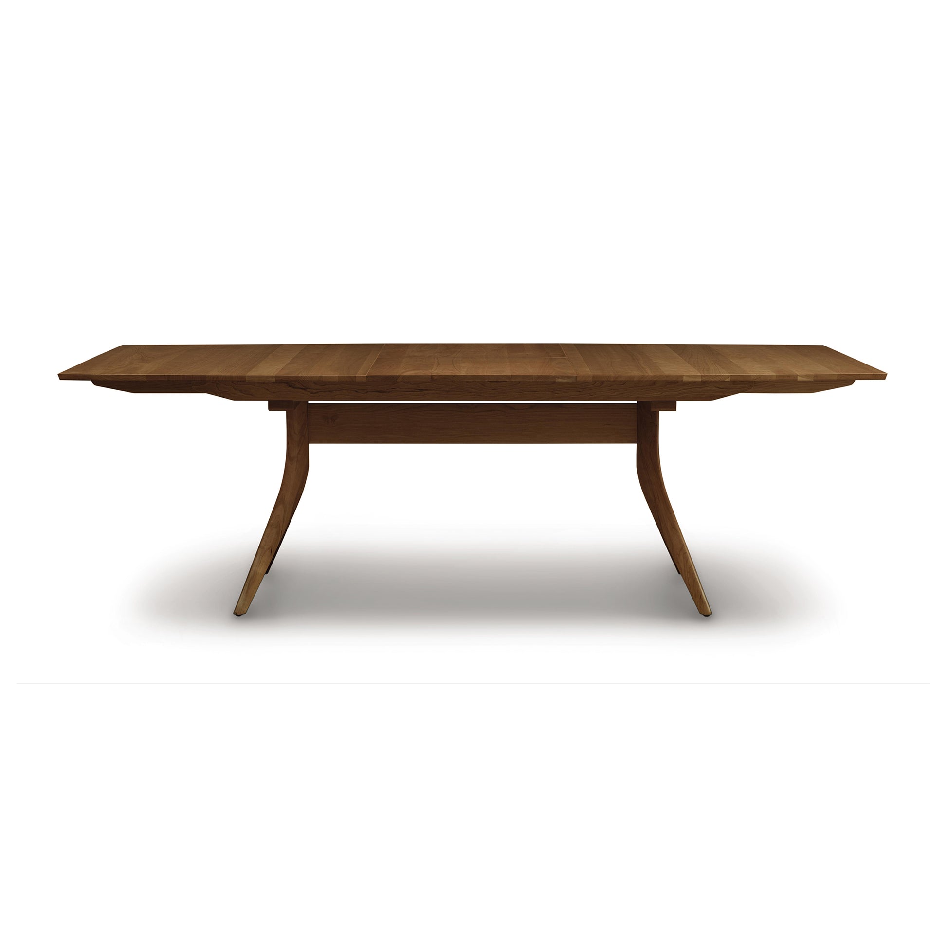 Copeland Catalina Trestle Extension Table made from solid American hardwood with angled legs and a smooth, polished top.