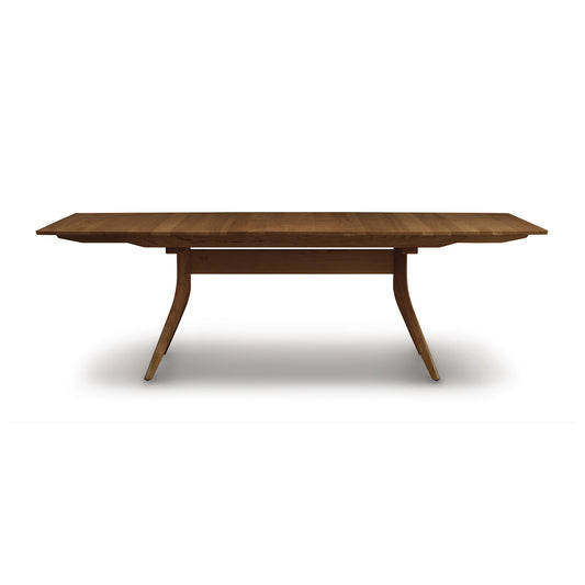Copeland Catalina Trestle Extension Table made from solid American hardwood with angled legs and a smooth, polished top.
