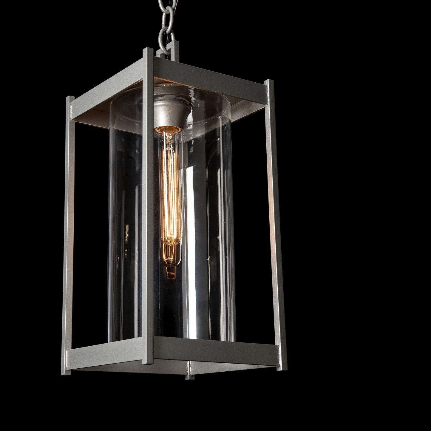 Cela Large Outdoor Lantern by Hubbardton Forge with metal frame, glass panels, and Edison-style bulb, showcasing elegant craftsmanship and design.