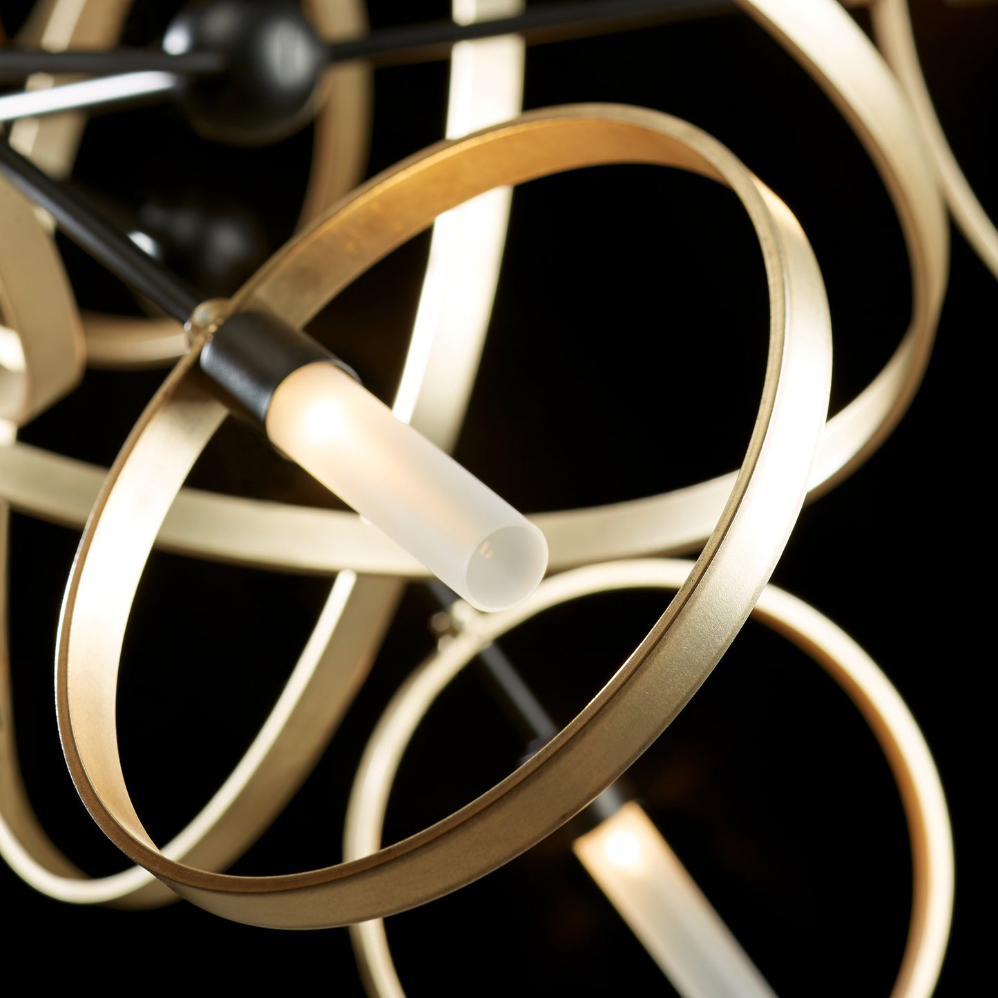 Celesse Pendant by Hubbardton Forge showcasing circular gold rings, tubular LED lights, and exquisite hand-forged steel craftsmanship.