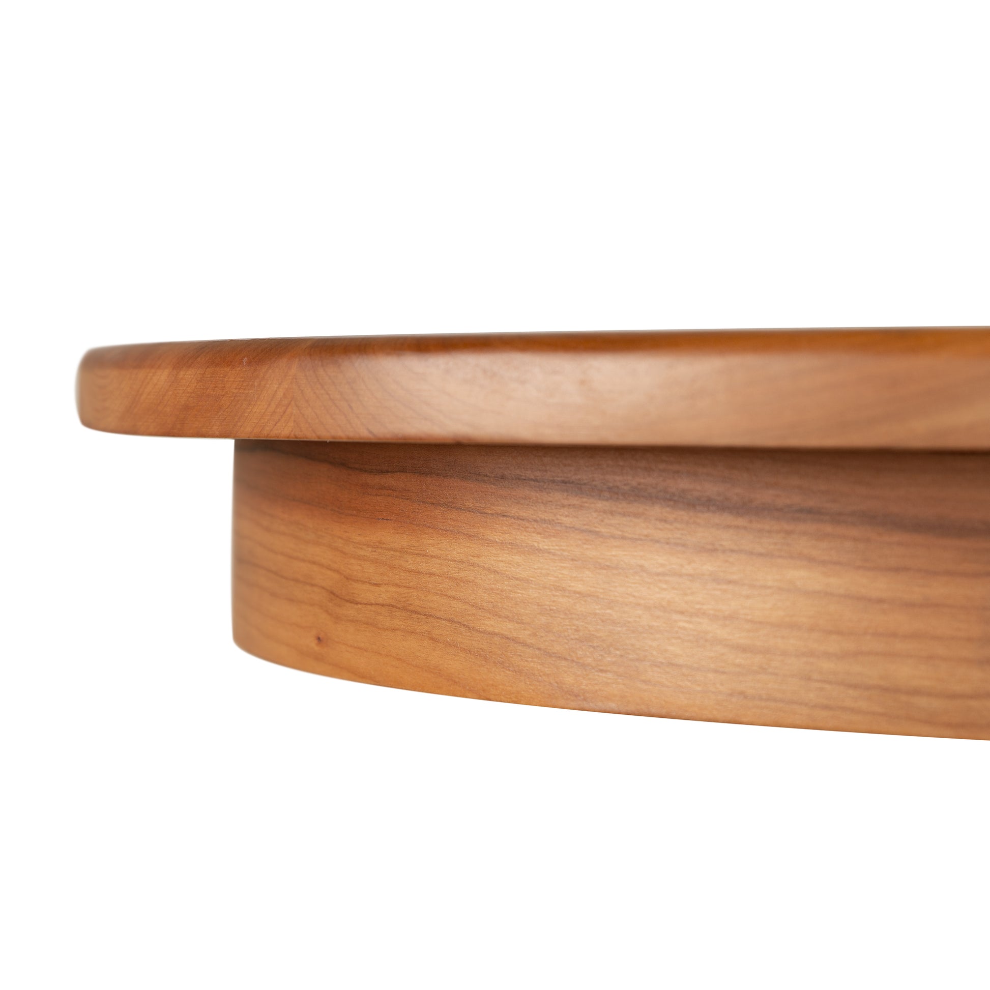 Detail view of the Lyndon Furniture Cherry Blossom Double Pedestal Extension Table showcasing its cherry wood craftsmanship and elegant edge design.