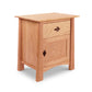 A Maple Corner Woodworks Cherry Moon 1-Drawer Nightstand With Door, crafted by a Vermont craftsman, on a plain white background.