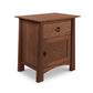 Vermont craftsman Maple Corner Woodworks Cherry Moon 1-Drawer Nightstand With Door, a solid wood bedroom furniture piece with a drawer and a cabinet door, isolated on a white background.