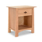 A Maple Corner Woodworks Cherry Moon 1-Drawer Enclosed Shelf Nightstand made from sustainably harvested hardwoods, featuring a single drawer with a metal handle and an open lower shelf, isolated on a white background.