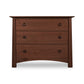 A Maple Corner Woodworks Cherry Moon 3-Drawer Chest made from sustainable hardwoods, with round knobs against a white background.