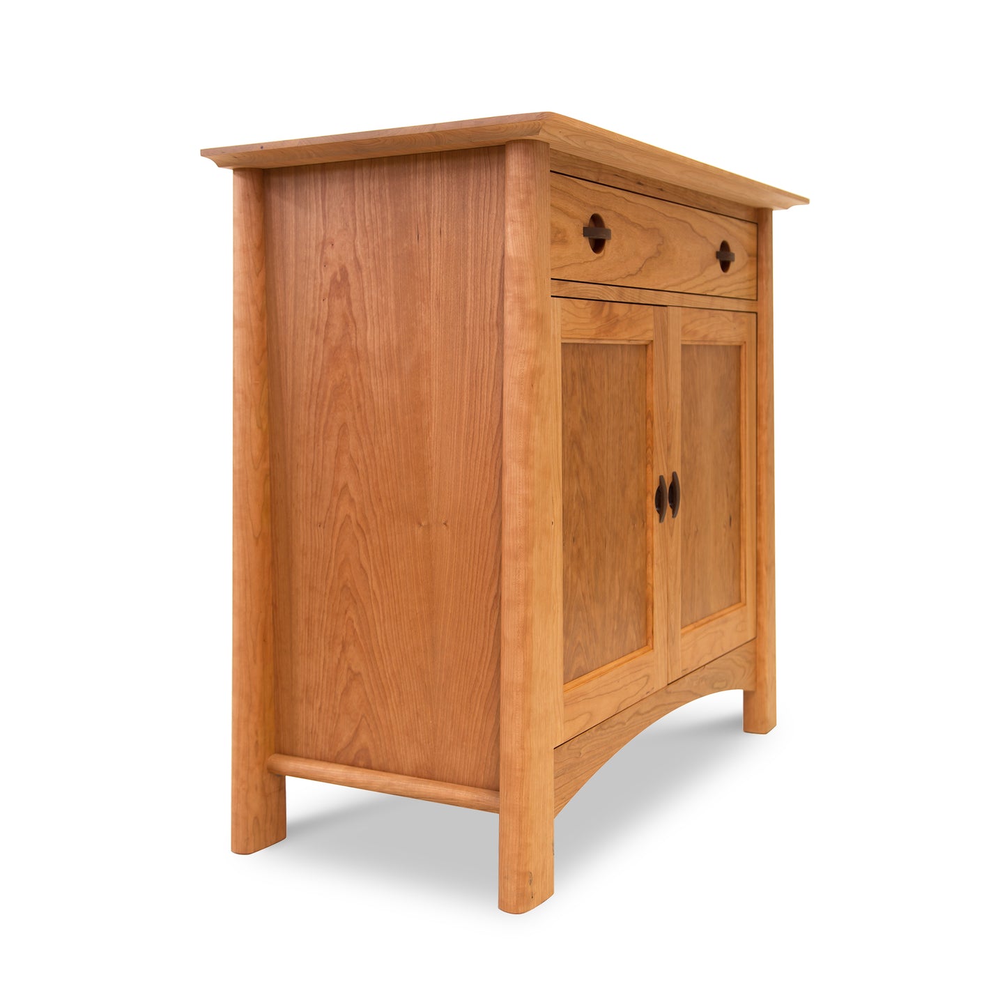 A Cherry Moon Small 38" Sideboard by Maple Corner Woodworks, with a small drawer on top and two doors below, featuring round black handles and standing upright against a white background.
