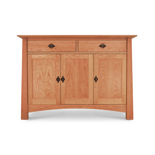 Luxury kitchen furniture: Maple Corner Woodworks Cherry Moon Medium Sideboard, a wooden sideboard with two doors and one drawer, featuring metal handles, isolated on a white background.