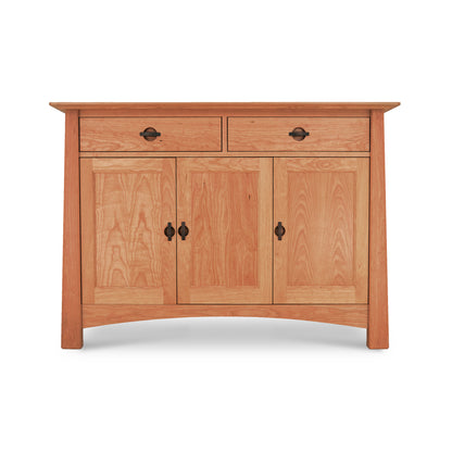 A wooden Maple Corner Woodworks Cherry Moon Medium Sideboard with two drawers at the top and two cabinet doors below, featuring black metal handles and a smooth, natural finish.