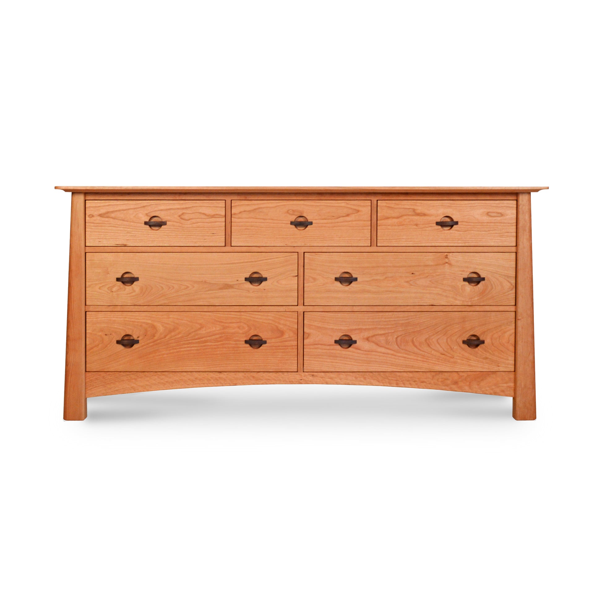 A Cherry Moon 7-Drawer Dresser from Maple Corner Woodworks, handmade from sustainably harvested wood, showcasing a natural finish and black metal handles, isolated on a white background.
