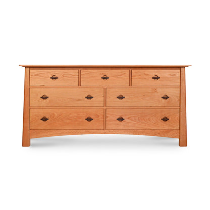 A Cherry Moon 7-Drawer Dresser from Maple Corner Woodworks, handmade from sustainably harvested wood, showcasing a natural finish and black metal handles, isolated on a white background.