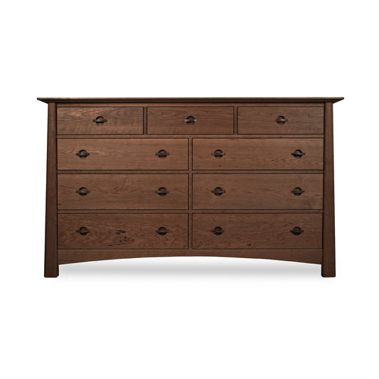 Cherry Moon 9-Drawer Dresser by Maple Corner Woodworks with dark metal handles, three small upper drawers and six spacious lower drawers; crafted from eco-friendly materials for a luxurious and sustainable bedroom centerpiece.