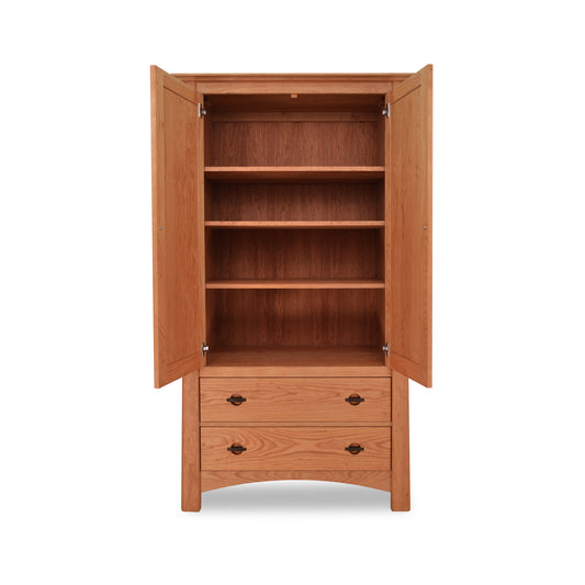 Cherry Moon Armoire by Maple Corner Woodworks showcasing solid hardwood with two doors, spacious shelves, and two closed drawers exemplifying Vermont craftsmanship.
