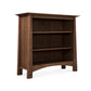 A Maple Corner Woodworks Cherry Moon Bookcase with three tiers, made from sustainably harvested hardwoods, isolated on a white background.
