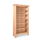 A tall Maple Corner Woodworks Cherry Moon bookcase with five shelves, crafted from sustainably harvested hardwoods, isolated on a white background.