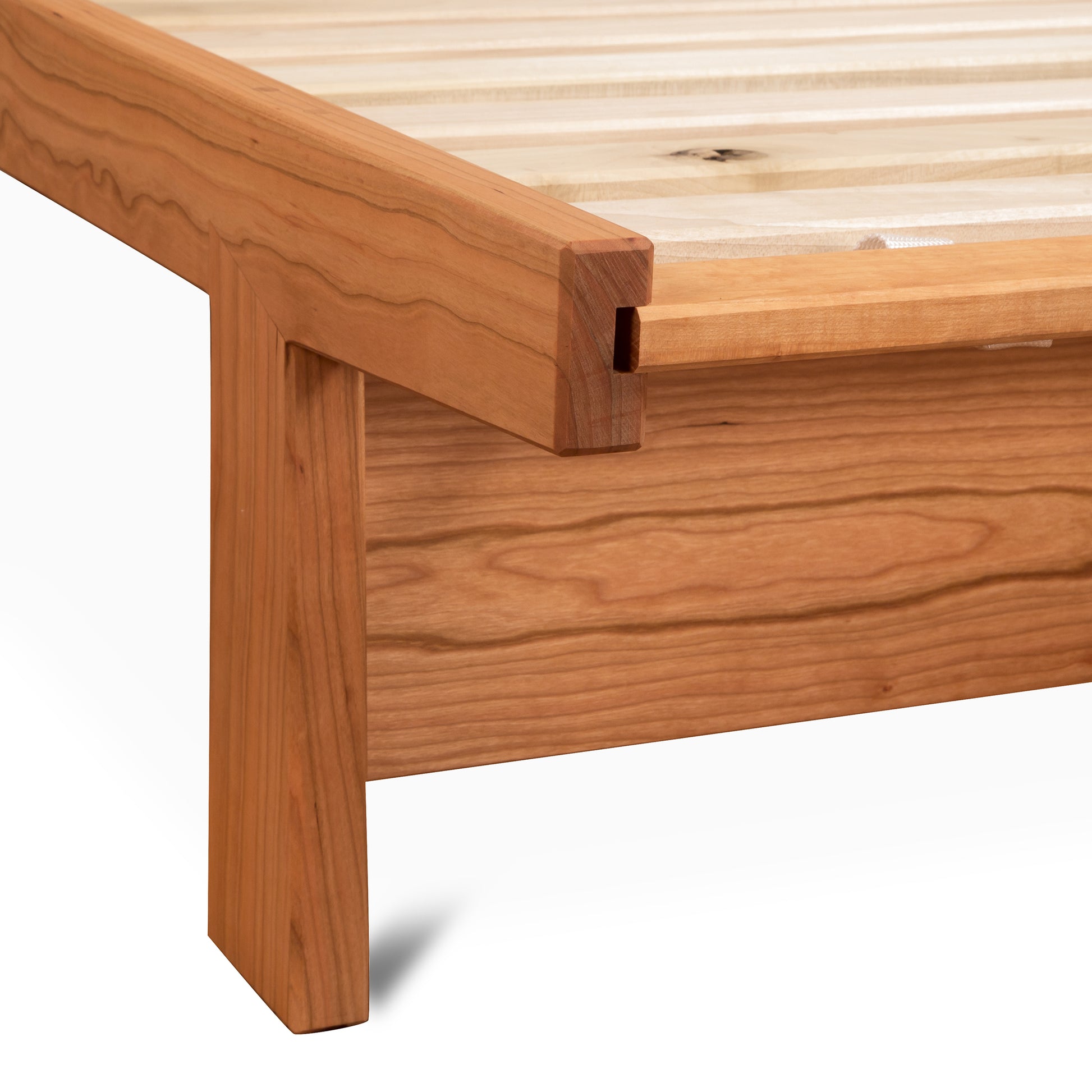 Cherry Moon Dovetail Platform Bed by Maple Corner Woodworks, showcasing intricate dovetail joinery with a light natural appearance and eco-friendly oil finish.