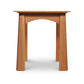 A wooden stool with a simplistic design featuring a flat top and a single arched support between two sturdy legs, isolated on a white background, crafted from Maple Corner Woodworks' Cherry Moon End Table.