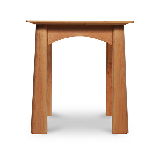 A Maple Corner Woodworks Cherry Moon end table with a single arch design stands isolated against a white background.