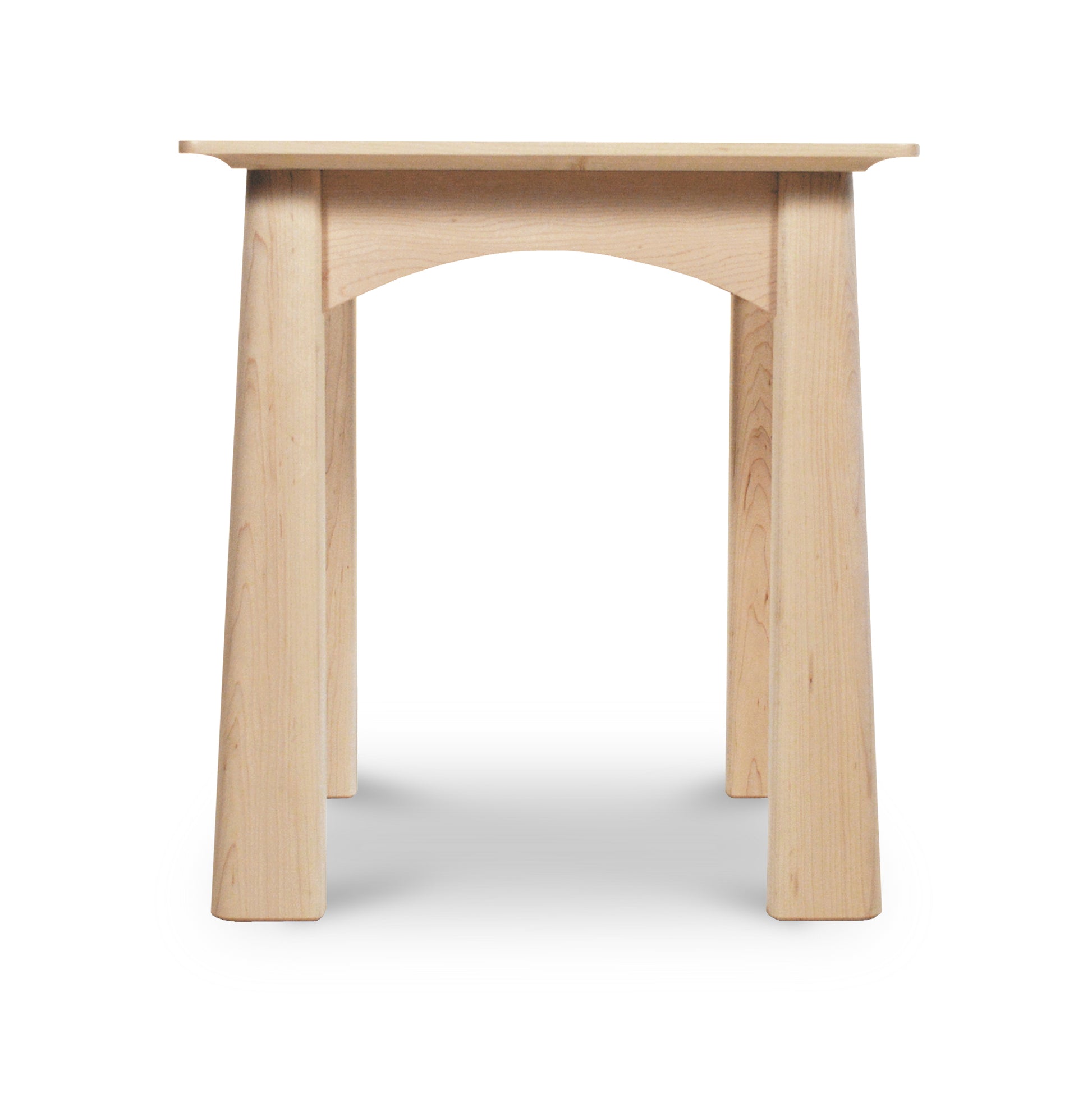 A simple Cherry Moon End Table, handmade by Maple Corner Woodworks in Vermont with a curved seat and sturdy, arched legs, isolated on a white background.