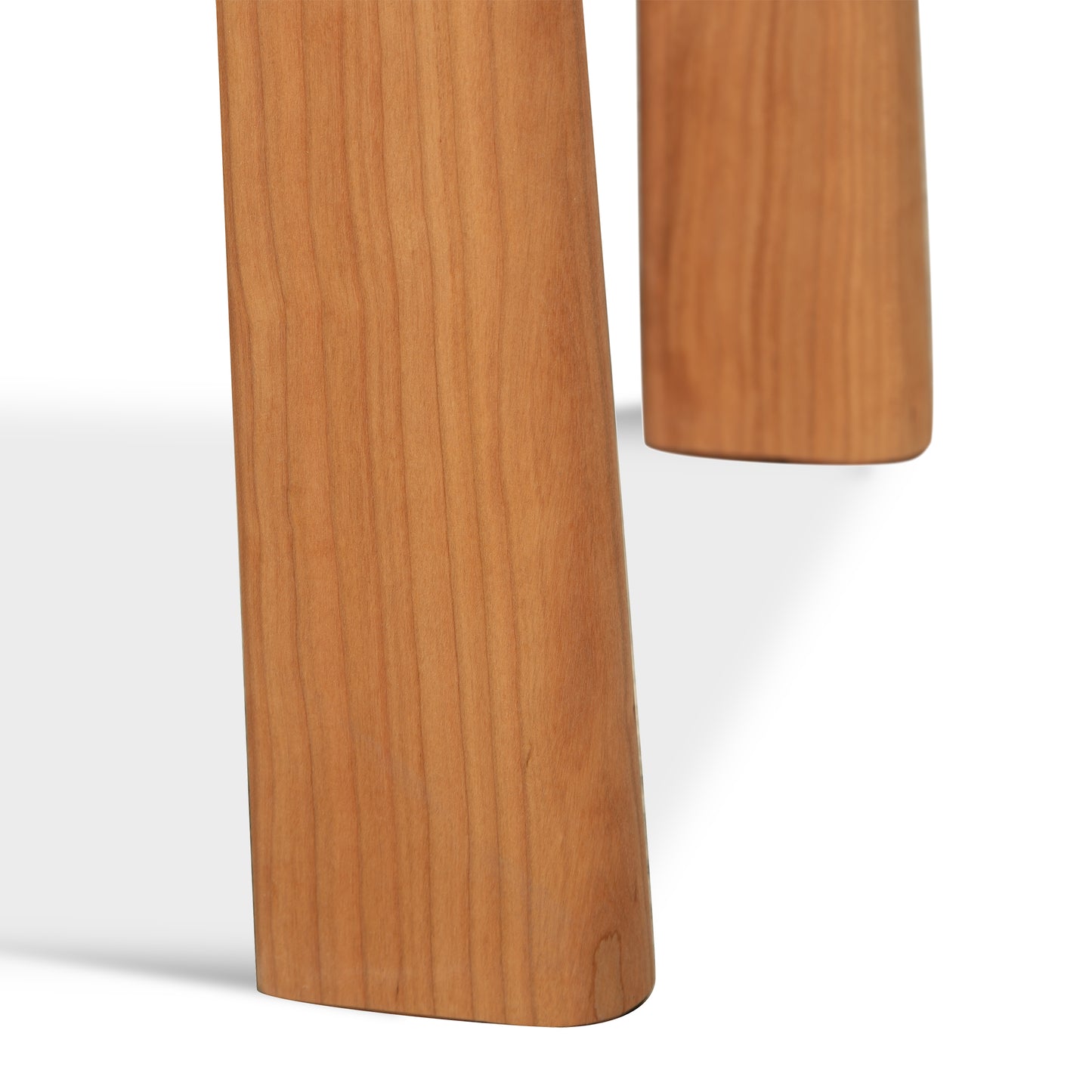 Cherry Moon End Table by Maple Corner Woodworks featuring close-up of angled wooden legs, handcrafted from cherry wood in Vermont.