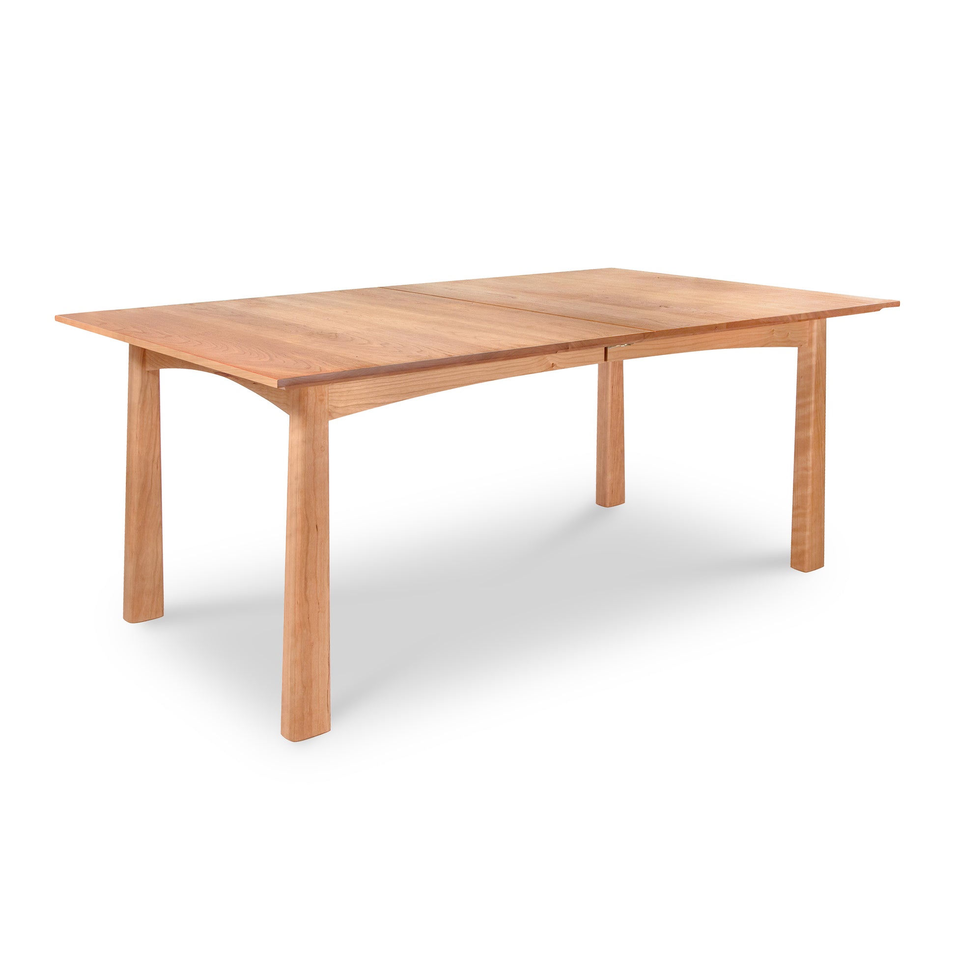 Cherry Moon Extension Dining Table by Maple Corner Woodworks with rectangular top and four sturdy legs, crafted from natural solid wood in a light finish, featuring an extendable design, epitomizing Arts & Crafts style.