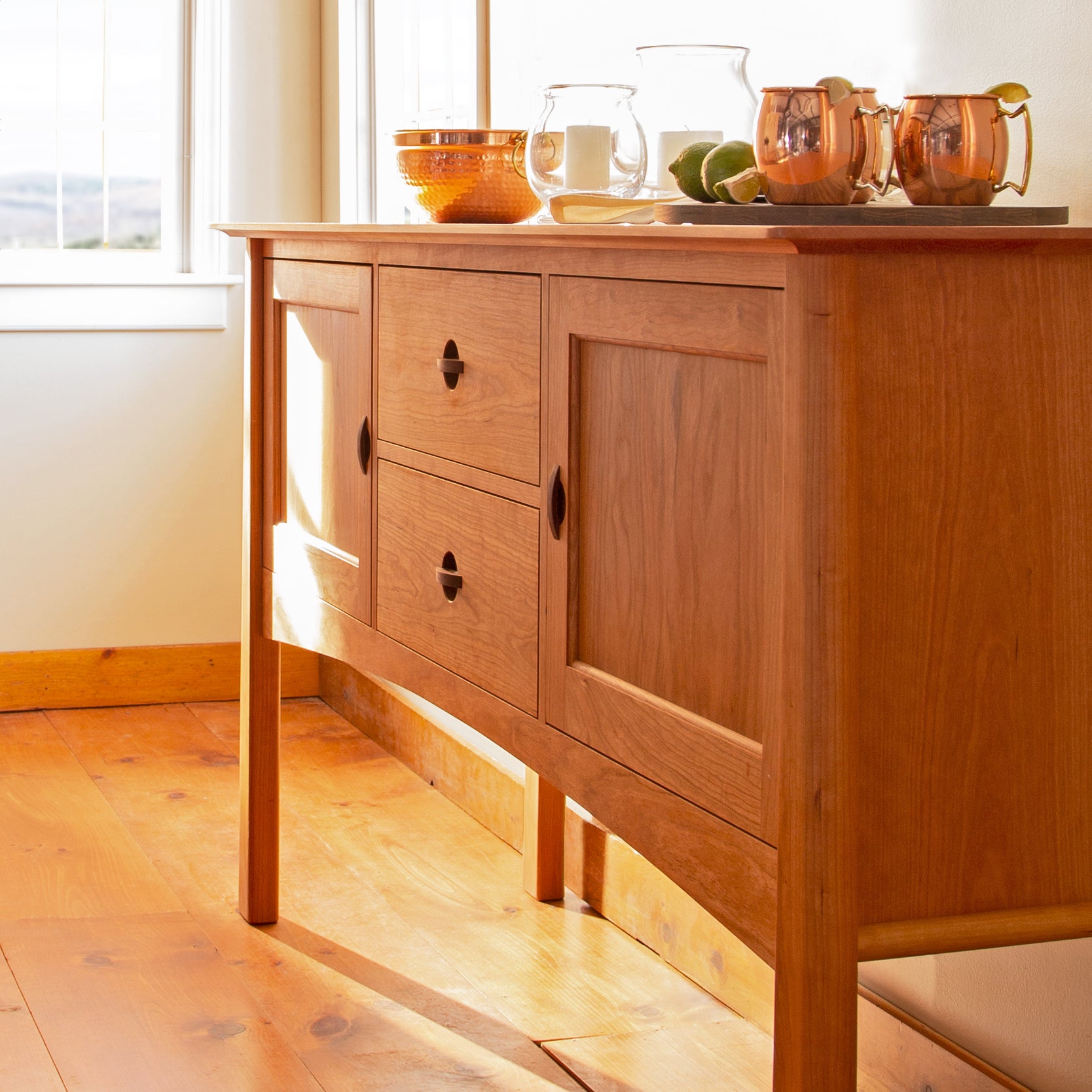 Cherry Moon Huntboard by Maple Corner Woodworks showcasing drawers and cabinets.