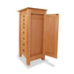 Maple Corner Woodworks Cherry Moon Jewelry Cabinet with open door and multiple drawers on one side, isolated on a white background.