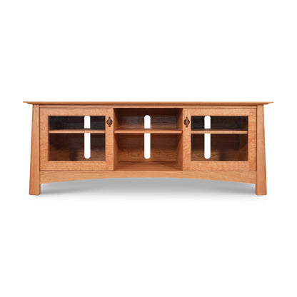 A hardwood Maple Corner Woodworks Cherry Moon 68" TV Console with a curved front, featuring three open shelves and white handle accents, isolated on a white background.