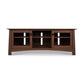 A Maple Corner Woodworks Cherry Moon 68" TV Console with a curved front, featuring three open shelves and additional storage space behind glass doors. The Cherry Moon TV Console is made of dark-stained wood and has a glossy finish.