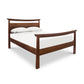 Asian style Cherry Moon Pagoda Bed with a white mattress and two pillows, isolated on a white background from Maple Corner Woodworks.