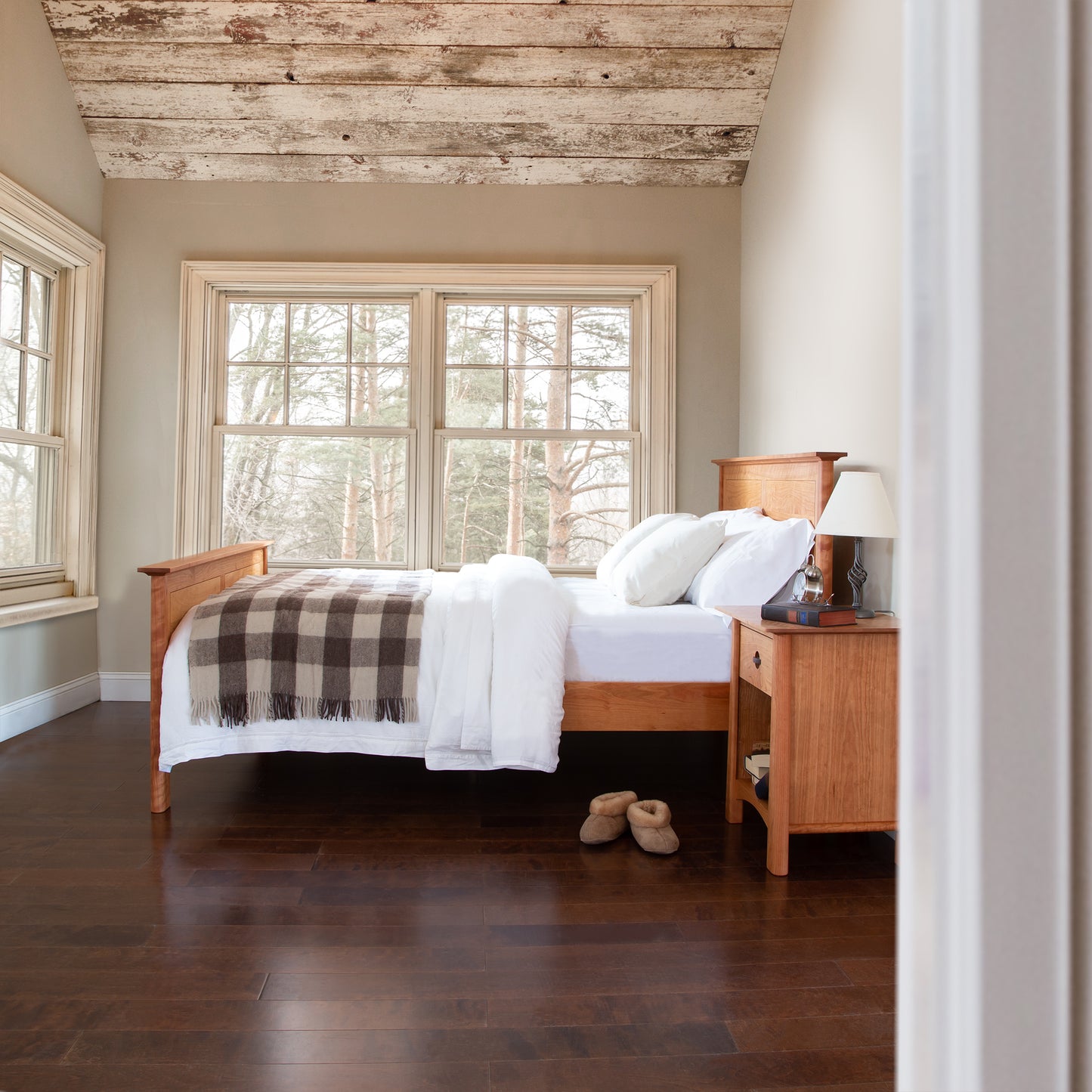 Cherry Moon Panel Bed by Maple Corner Woodworks with white bedding, flanked by matching nightstands.