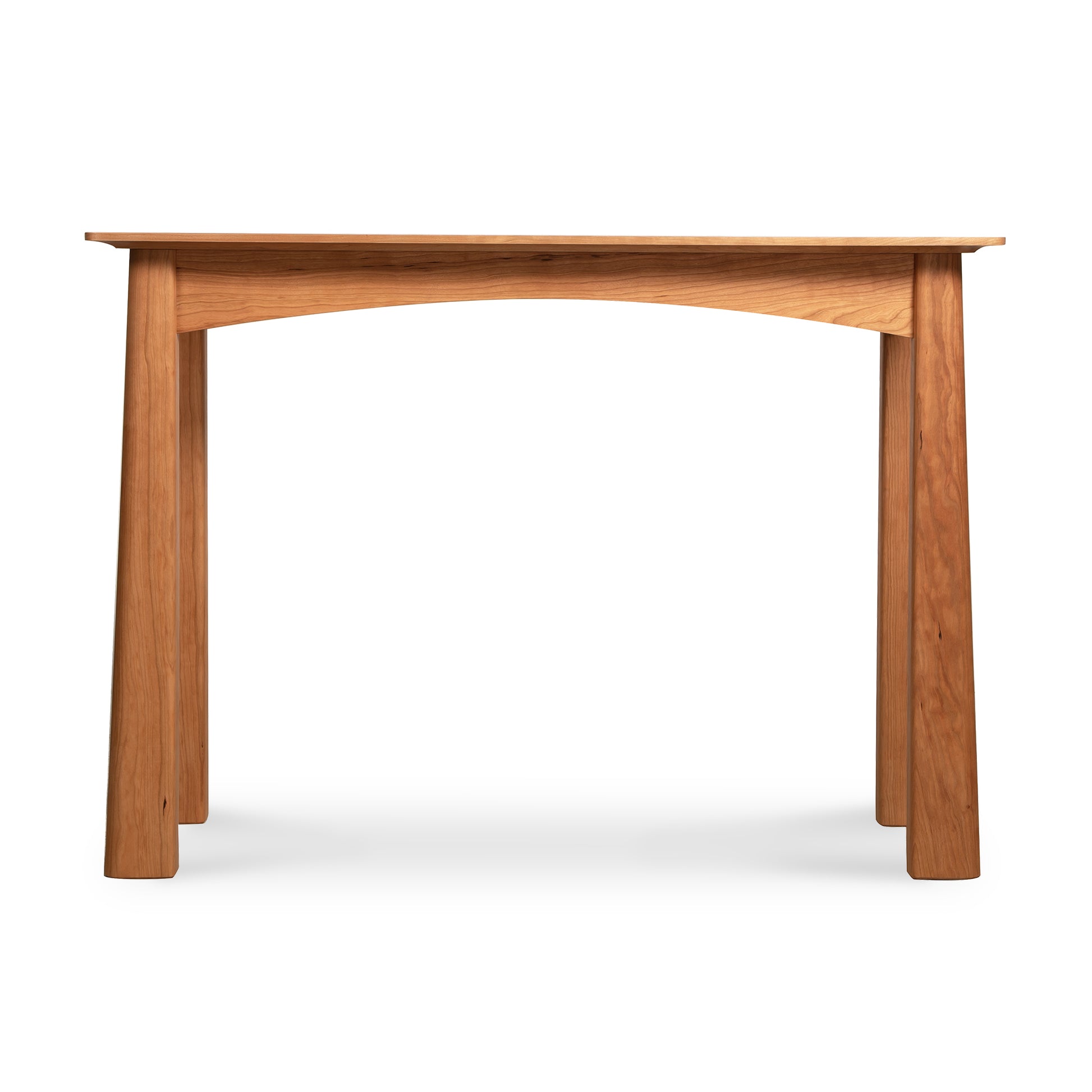 A simple American-made Cherry Moon Sofa Table from Maple Corner Woodworks with a smooth tabletop and sturdy, slightly tapered legs, isolated on a white background.