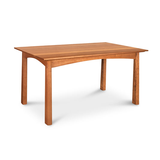 A simple Cherry Moon Solid Top Dining Table from Maple Corner Woodworks with a rectangular top and four sturdy legs, isolated on a white background.