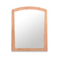 A Cherry Moon Vertical Mirror with an arched top isolated on a white background by Maple Corner Woodworks.