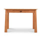 Maple Corner Woodworks Cherry Moon Writing Desk, a solid wood desk with a single centered drawer, displayed against a white background.