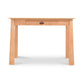 An eco-friendly Maple Corner Woodworks Cherry Moon Writing Desk with a single central drawer against a white background.
