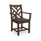 A brown outdoor patio furniture POLYWOOD Chippendale Outdoor Dining Arm Chair with a lattice back design and armrests, isolated on a white background.