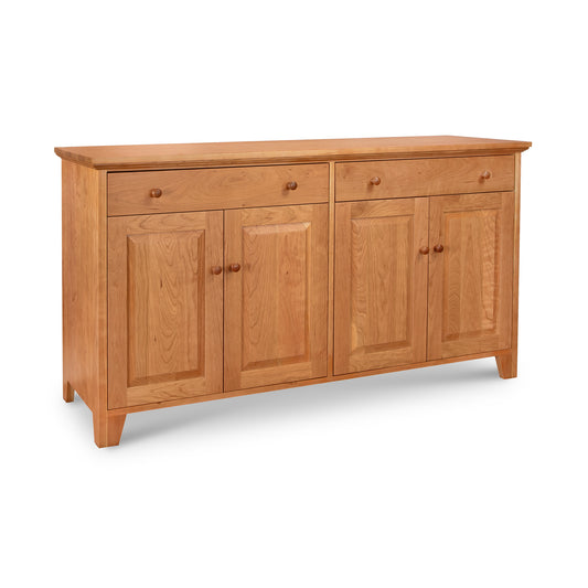 This Classic Country Buffet, expertly crafted by Lyndon Furniture in Vermont, features solid hardwood construction. It has two doors and two drawers for ample storage space.