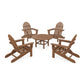 Four brown POLYWOOD Classic Folding Adirondack chairs arranged around a small, round wooden table on a plain white background.
