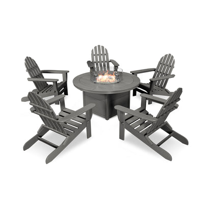 An POLYWOOD outdoor furniture set featuring a circular fire pit table surrounded by four dark gray POLYWOOD Classic Folding Adirondack rocking chairs on a white background. The fire pit is lit, adding a cozy ambiance.