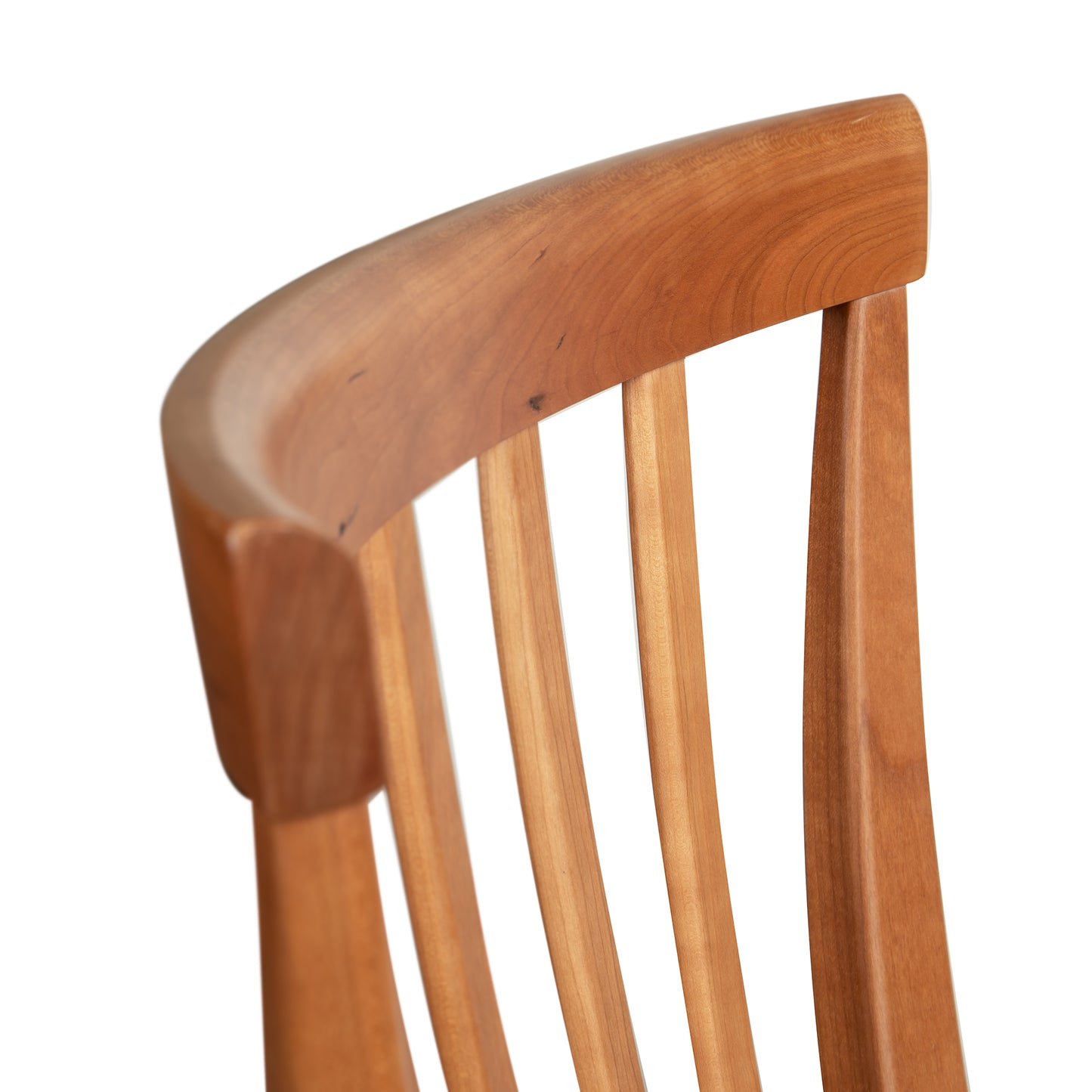 Lyndon Furniture Classic Shaker Chair #1 featuring a curved top rail, vertical slats, smooth finish, and warm wood tones.